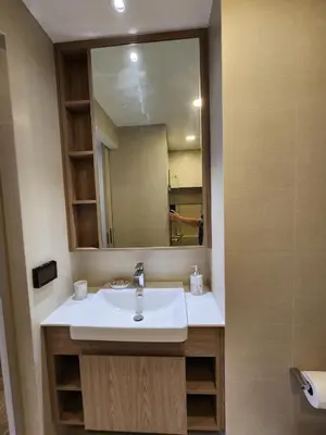 a bathroom with a sink and a mirror at Skypark Laguna Apartment with Rooftop Pool at Bang Tao Phuket in Laguna Phuket