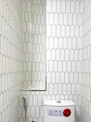 a bathroom with a toilet and a mirror in it at M2 Room For Rent in Patong Beach