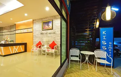 a room with chairs and tables in a store at Kiss Hometel in Ao Nang Beach