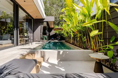 a pool in the backyard of a house with plants at Aileen Naithon Hills - Tropical Haven Retreat in Nai Thon Beach