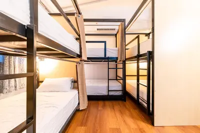 a dorm room with bunk beds in it at Queen On Street 2009 in Ban Lo Long