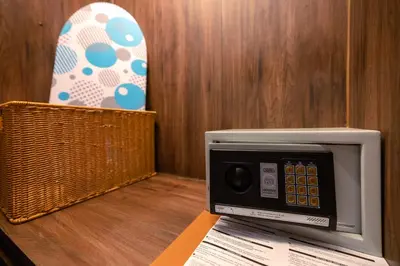 a microwave oven sitting on top of a table at The Beach Residence Kata in Kata Beach