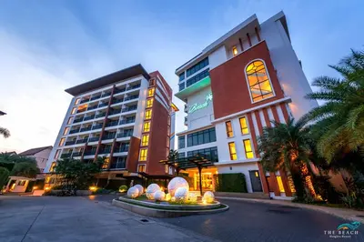 a large building with a clock on the side of it at The Beach Residence Kata in Kata Beach