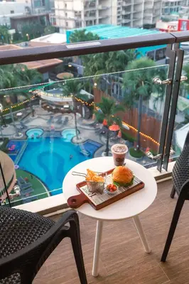 a tray of food on a table on a balcony at The Beach Residence Kata in Kata Beach