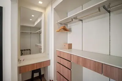 a bathroom with a sink and a mirror at Laguna Parkside Residences by Banyan Living in Phuket Town