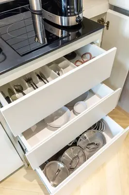 an open refrigerator drawer filled with dishes at Tropical studio Luxury Amenities and Pool in Bang Tao Beach