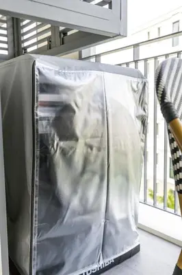 a container covered in plastic sitting next to a window at Tropical studio Luxury Amenities and Pool in Bang Tao Beach