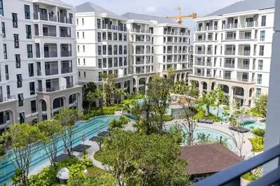 an apartment view of a courtyard with buildings at Tropical studio Luxury Amenities and Pool in Bang Tao Beach