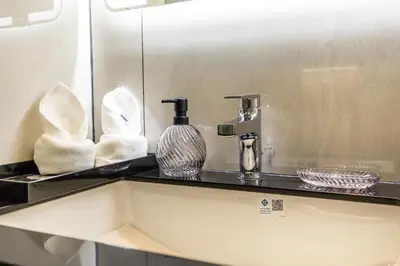 a bathroom counter with a sink and a mirror at Tropical studio Luxury Amenities and Pool in Bang Tao Beach