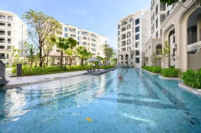 a swimming pool in the middle of a building at Bangtao The Title Legendary by Phuket Sabay Rent G402 in Bang Tao Beach