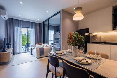 a dining room and kitchen with a table and chairs at Bangtao The Title Legendary by Phuket Sabay Rent C108 in Bang Tao Beach