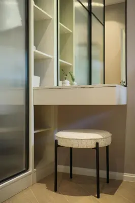 a stool sitting under a mirror in a closet at Bangtao The Title Legendary by Phuket Sabay Rent C108 in Bang Tao Beach