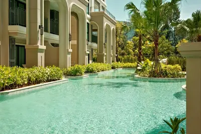 a swimming pool in front of a building at Bangtao The Title Legendary by Phuket Sabay Rent D204 in Bang Tao Beach