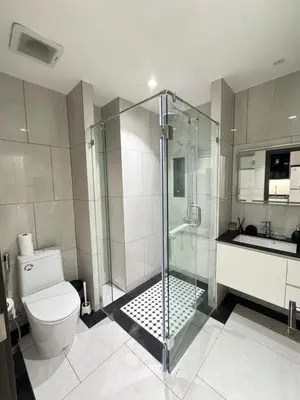 a bathroom with a shower and a toilet and a sink at Title Legendary in Phuket