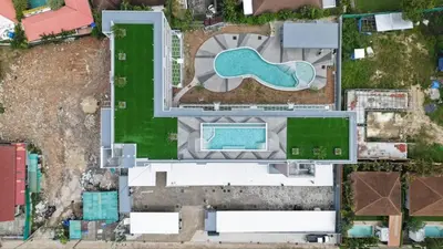 an aerial view of a building with a swimming pool at Babylon Sky Garden 2 in Rawai Beach
