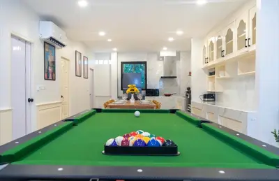 a room with a pool table with balls on it at Patong Center lucky home in Patong Beach