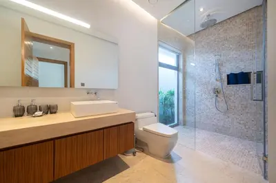 a bathroom with a sink and a toilet and a shower at Thai-Balinese Pool Villa Anchan Indigo16 in Ban Phru Champa