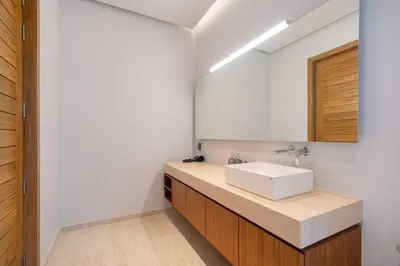 a bathroom with a sink and a mirror at Thai-Balinese Pool Villa Anchan Indigo16 in Ban Phru Champa