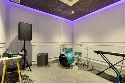 a room with a stage with a tv and drums at Bangtao The Title Legendary by Phuket Sabay Rent F601 in Bang Tao Beach