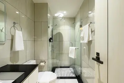 a bathroom with a shower and a toilet at Bangtao The Title Legendary by Phuket Sabay Rent F201 in Bang Tao Beach