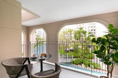 a room with a balcony with a table and chairs at Bangtao The Title Legendary by Phuket Sabay Rent F201 in Bang Tao Beach