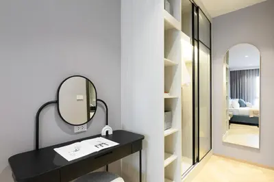 a bathroom with a black vanity and a mirror at Bangtao The Title Legendary by Phuket Sabay Rent A212 in Bang Tao Beach