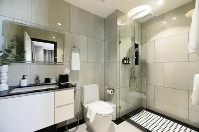 a bathroom with a shower and a toilet and a sink at Bangtao The Title Legendary by Phuket Sabay Rent F511 in Bang Tao Beach