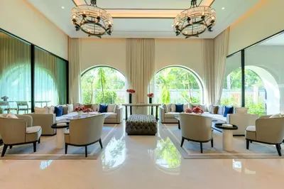 a lobby with couches and chairs and windows at Bangtao The Title Legendary by Phuket Sabay Rent F511 in Bang Tao Beach