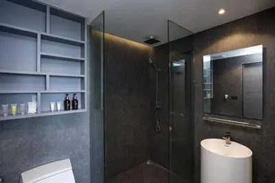 a bathroom with a shower and a toilet and a sink at 2 BR Apt Pool View - CTG B507-8 in Kamala Beach