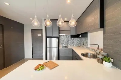 a kitchen with a plate of fruit on a counter at 2 BR Apt Pool View - CTG B507-8 in Kamala Beach