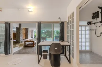 a home office with a desk and a chair at V89 6BR Timeless Design Huge Pool & Mountain View in Rawai Beach