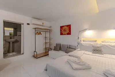 a white bedroom with two beds and a couch at V89 6BR Timeless Design Huge Pool & Mountain View in Rawai Beach