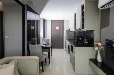 a living room with a kitchen and a dining room at Mida Grande Ocean View in Surin Beach