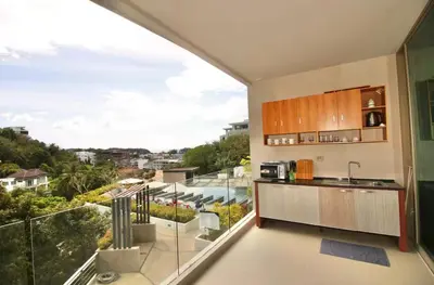 a kitchen with a large balcony with a view at Pool and See View Amazing Room in Karon Beach