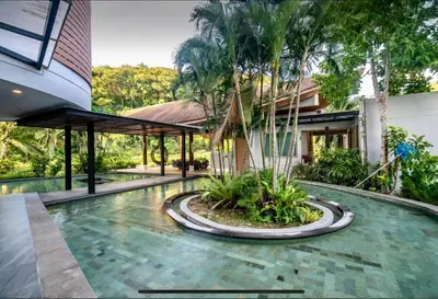 a swimming pool in front of a house at Pool and See View Amazing Room in Karon Beach