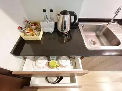 a small kitchen with a sink and a counter at BP Sweet Home Bang Tao - Studio in Ban Thalat Choeng Thale