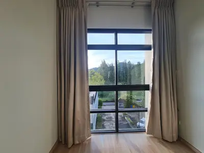 a room with a large window with a view at BP Sweet Home Bang Tao - Studio in Ban Thalat Choeng Thale