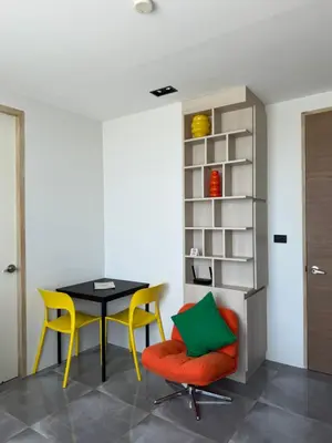 a dining room with a table and yellow chairs at 1BR Patong Hideaway - Pool - Near Beaches - A403 in Patong Beach