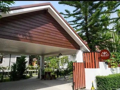 a pavilion with a picnic table under a building at Baan Ati Villas in Ban Han Pa To