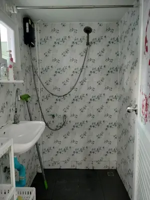 a small bathroom with a sink and a shower at Soi Saliga in Rawai Beach
