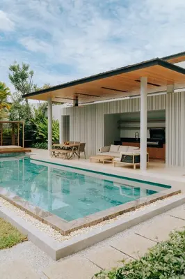 a swimming pool in front of a house at Botanica Foresta B09 in Ban Phru Champa