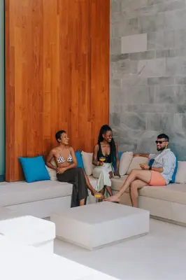 a group of people sitting on couches in a room at Botanica Foresta B09 in Ban Phru Champa