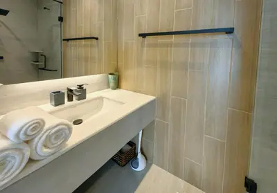 a white bathroom with a sink and a shower at Bangtao Luxury Pool Villa - PrymaSelva in Laguna Phuket