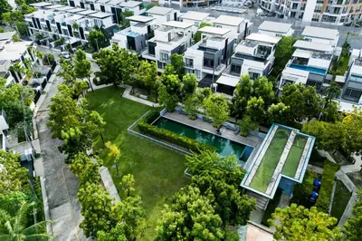 an aerial view of an apartment complex with a garden at Villa Laguna Park in Ban Thalat Choeng Thale