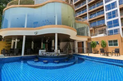 a large swimming pool in front of a building at Smily Phuket Patong Sea View in Patong Beach