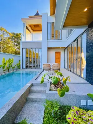 a home with a swimming pool and a house at Golden Andes \u8c6a\u534e\u5ea6\u5047\u522b\u5885 in Ban Mut Dok Khao