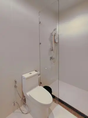 a bathroom with a toilet and a shower at Golden Andes \u8c6a\u534e\u5ea6\u5047\u522b\u5885 in Ban Mut Dok Khao