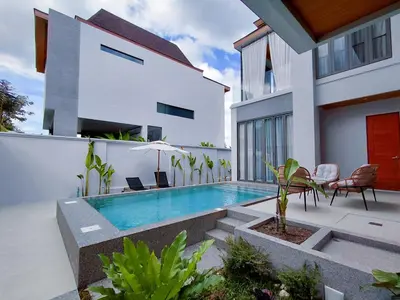a swimming pool in the backyard of a house at Golden Andes \u8c6a\u534e\u5ea6\u5047\u522b\u5885 in Ban Mut Dok Khao