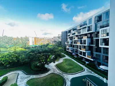 arial view of a building with a park and trees at Cozy studio 1 bdr Golf view in Laguna Phuket