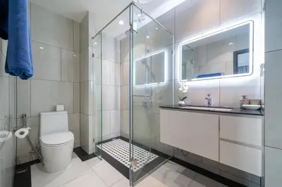a bathroom with a shower and a toilet and a sink at The Title Legendary D-605 1 BR Bangtao Beach in Bang Tao Beach